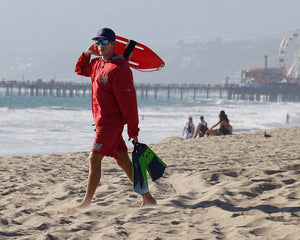 Lifeguard guy at the beach with reef-safe sunscreen on Noz